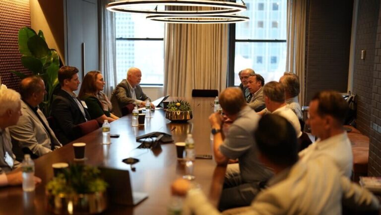 A premium boardroom representing high-achieving global leaders meeting to discuss strategic wealth planning instead of public rumors.