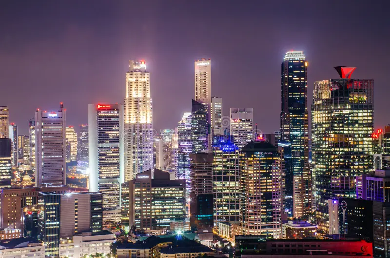 A successful entrepreneur overlooking the city skyline, planning long-term asset expansion and security.