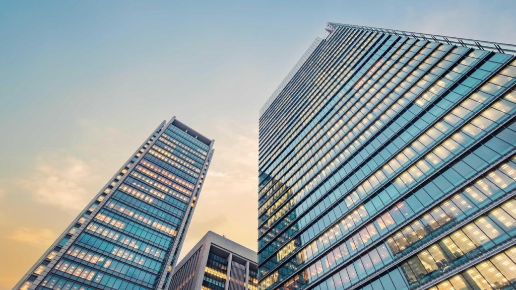 A successful entrepreneur overlooking the city skyline, planning long-term asset expansion and security.