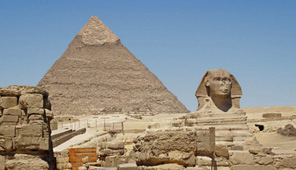 A stone monument displaying ancient geometry and masonic symbols representing visual alignment.